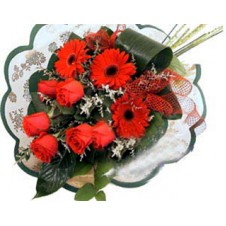 Wrapped Bouquet Of Red Gerbera daises And Roses